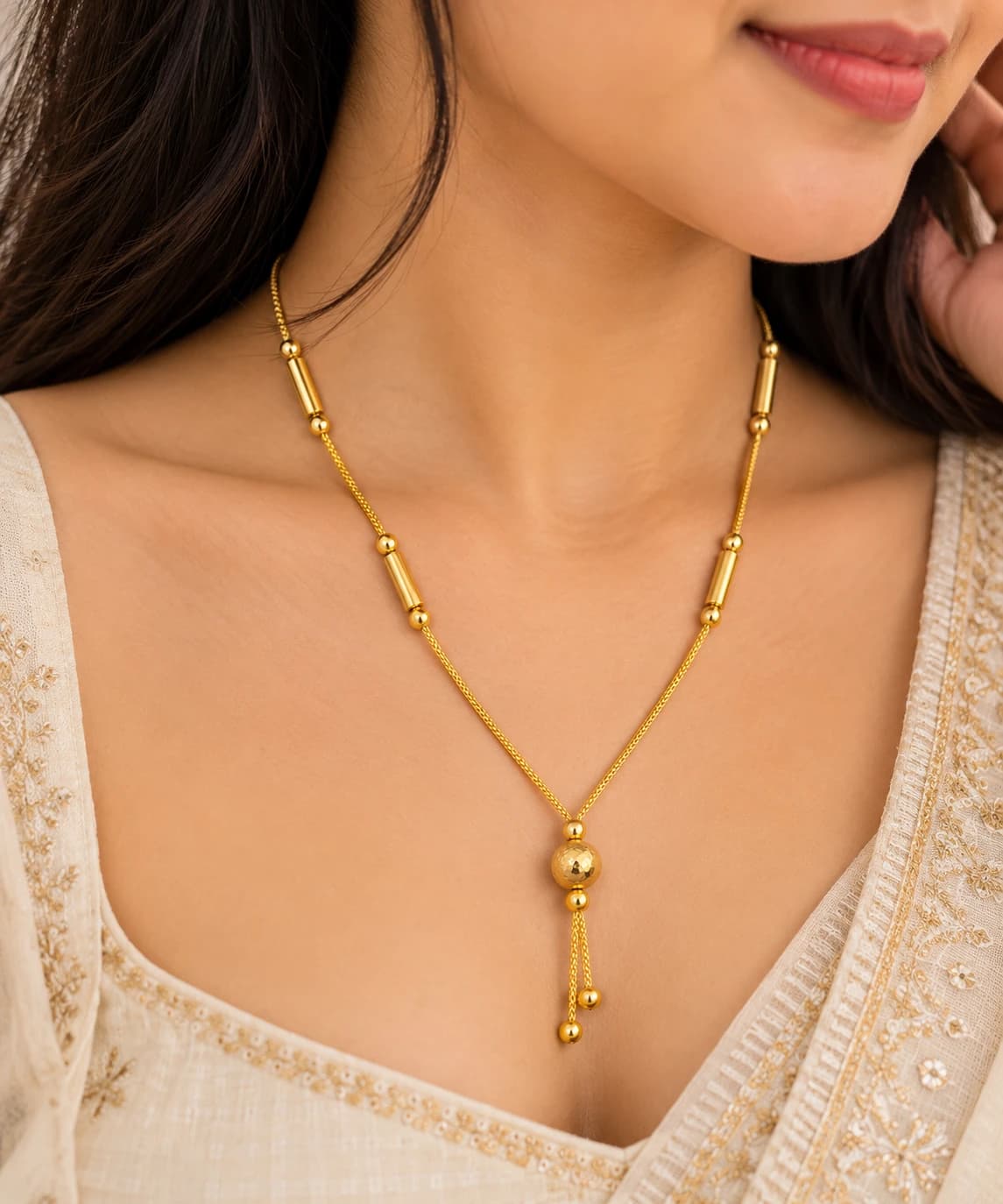 Kiara gold beads mangalsutra worn with an ivory embroidered outfit